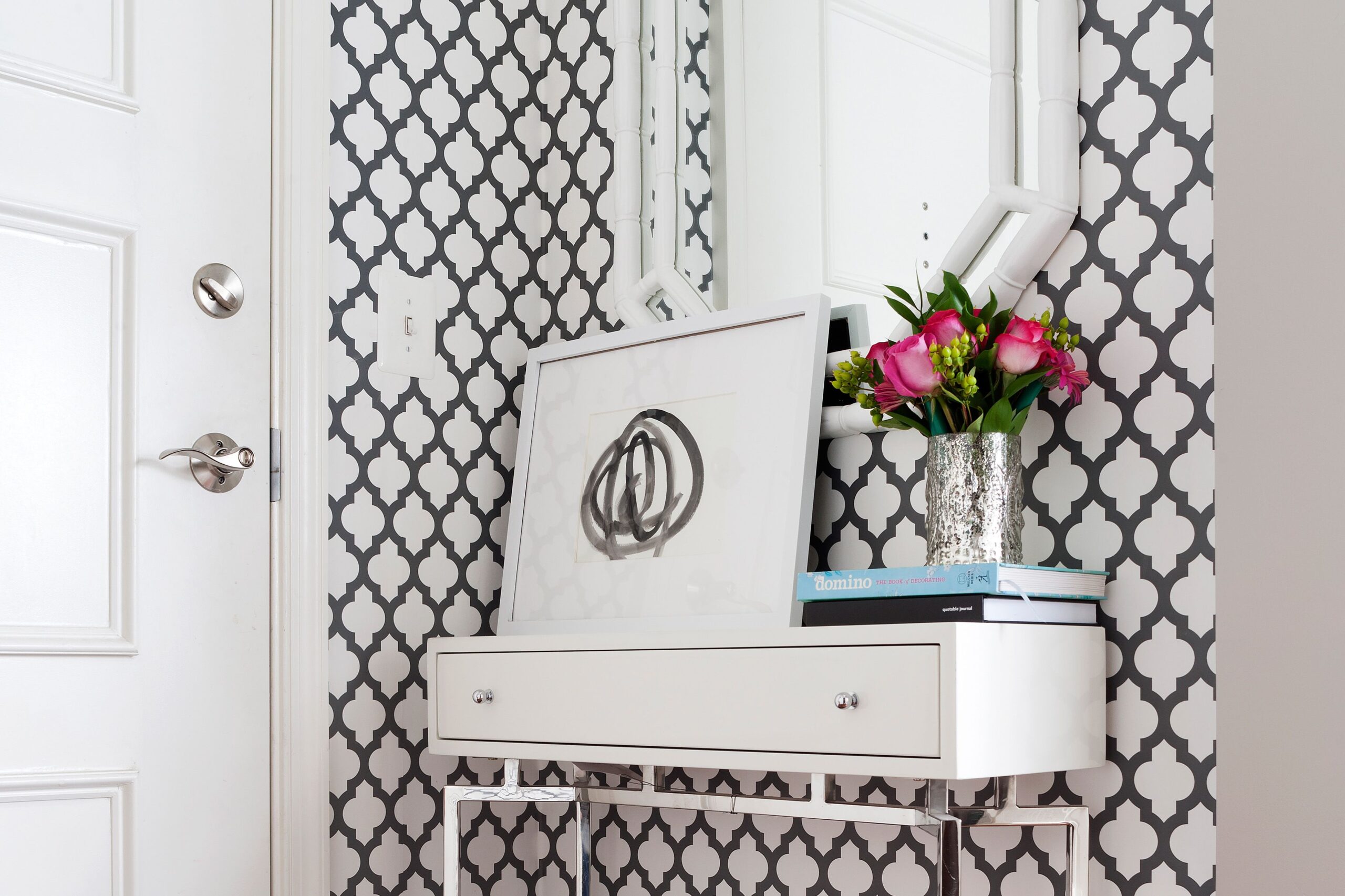 stylish small entryway with table and mirror
